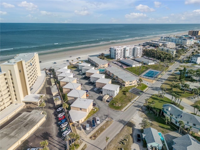 aerial view featuring a water view and a beach view