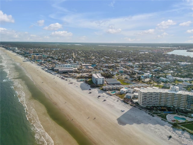 drone / aerial view with a view of the beach and a water view