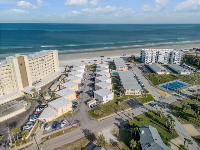 aerial view featuring a water view and a beach view