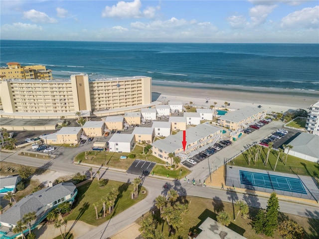 birds eye view of property featuring a water view and a view of the beach