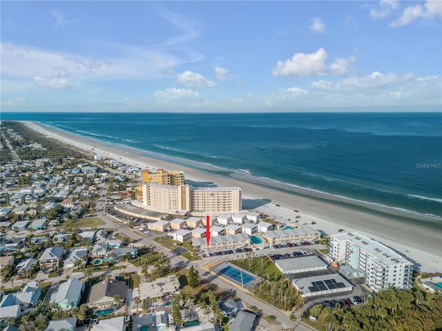 birds eye view of property featuring a view of the beach and a water view