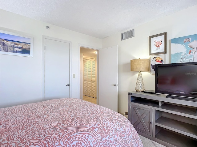 bedroom featuring a textured ceiling