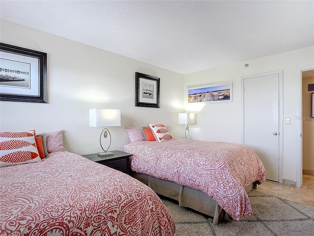 bedroom featuring a textured ceiling