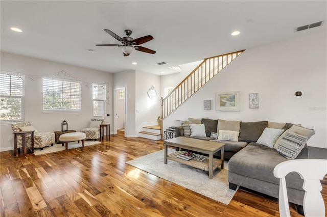 living room with ceiling fan and wood-type flooring