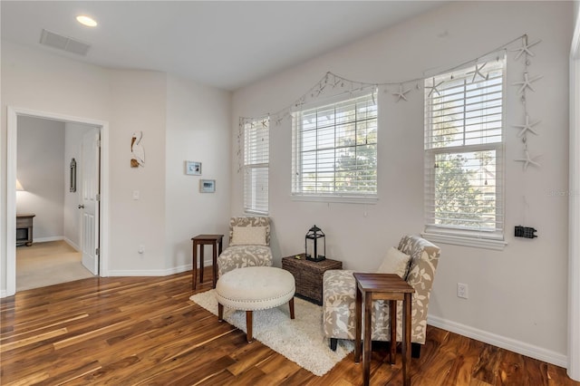 sitting room with hardwood / wood-style floors