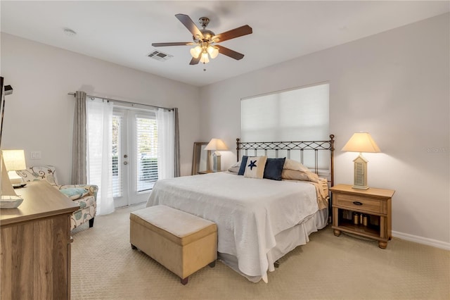 bedroom featuring access to exterior, light colored carpet, french doors, and ceiling fan