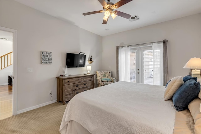 carpeted bedroom with access to outside, french doors, and ceiling fan