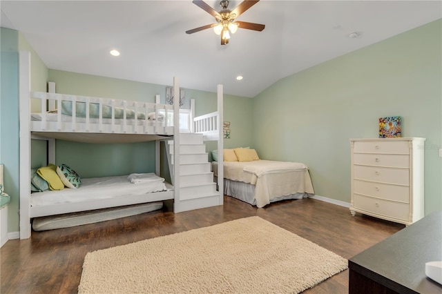 bedroom featuring lofted ceiling, dark hardwood / wood-style floors, and ceiling fan