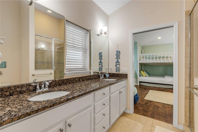 bathroom with tile patterned flooring and vanity