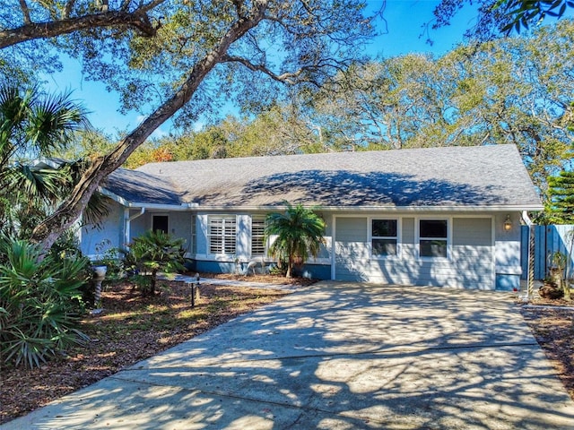 ranch-style home featuring a garage