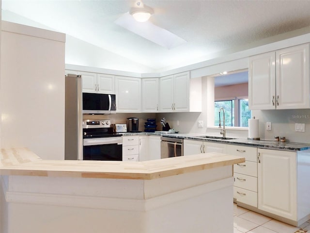 kitchen featuring white cabinetry, stainless steel appliances, and sink