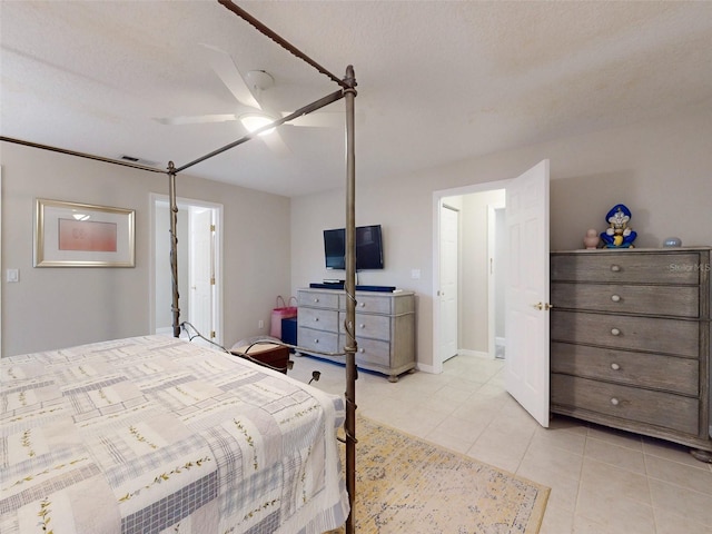 tiled bedroom with ceiling fan