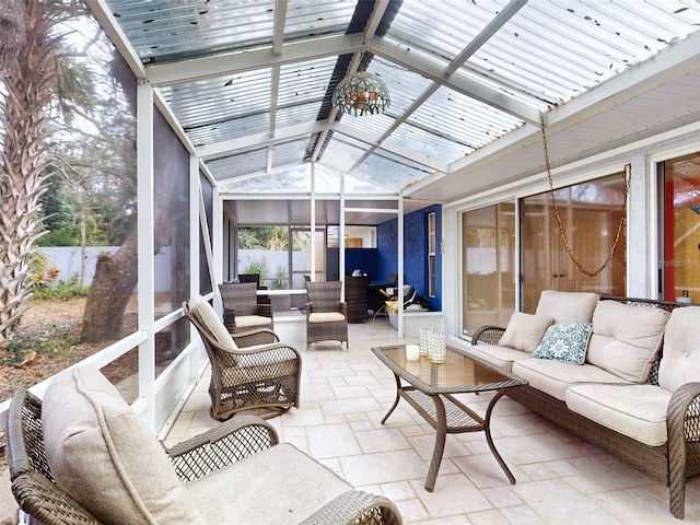 sunroom / solarium with vaulted ceiling