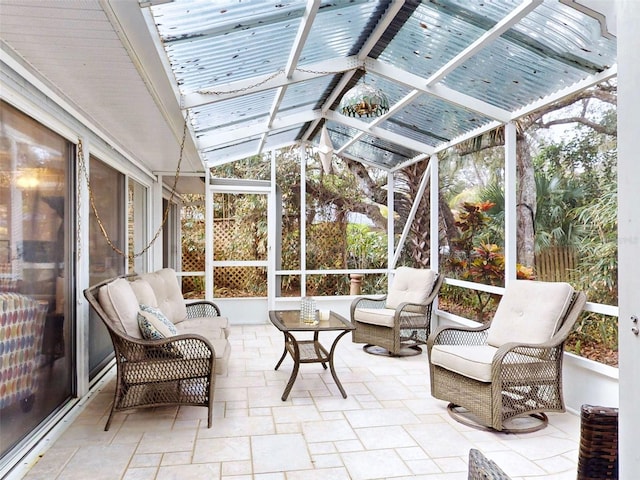 sunroom / solarium featuring lofted ceiling