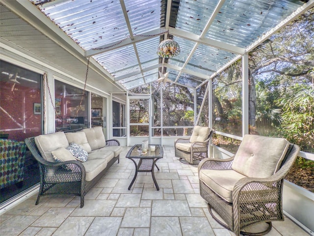 sunroom featuring vaulted ceiling