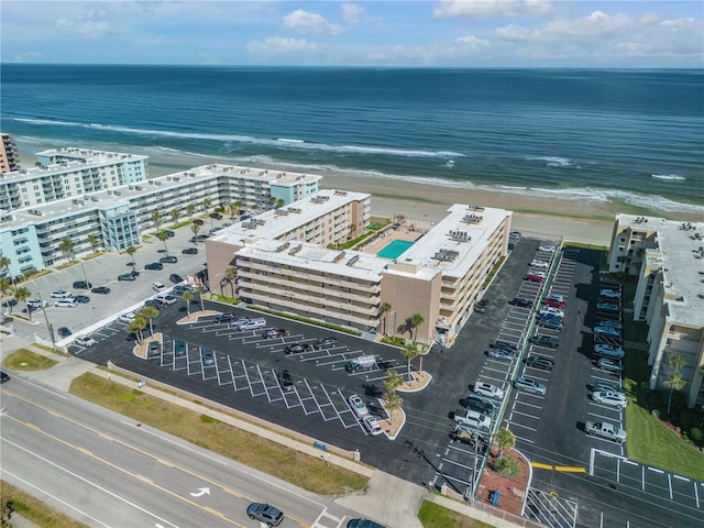 bird's eye view featuring a beach view and a water view