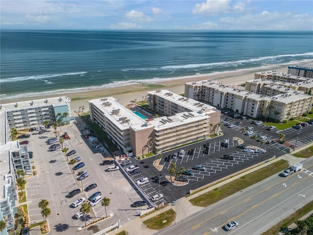 drone / aerial view with a view of the beach and a water view