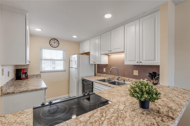 kitchen with sink, range, dishwasher, light stone countertops, and white cabinets