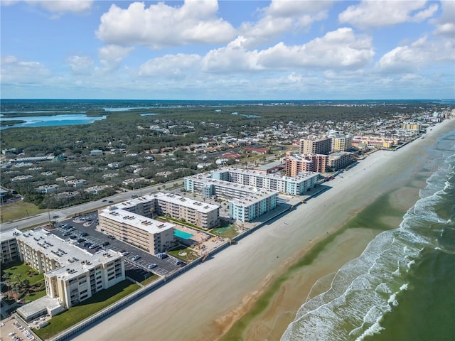 aerial view featuring a view of the beach and a water view