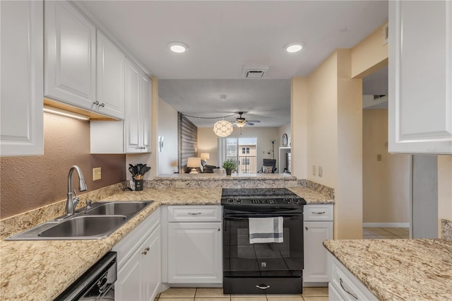 kitchen featuring white cabinetry, sink, light tile patterned flooring, and black appliances