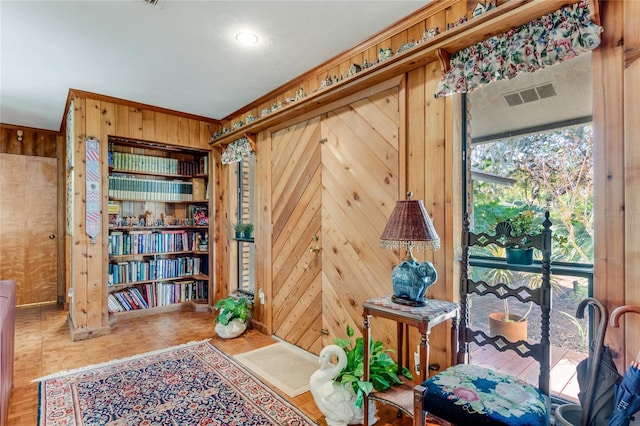 sitting room with wood walls