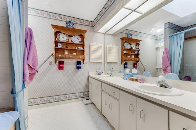 bathroom with vanity and a skylight