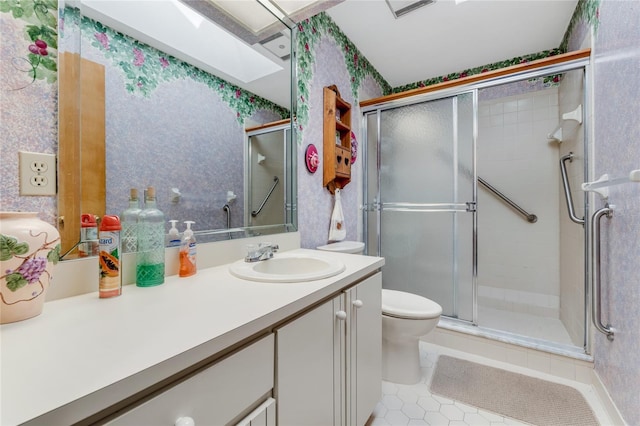 bathroom with vanity, an enclosed shower, tile patterned floors, and toilet