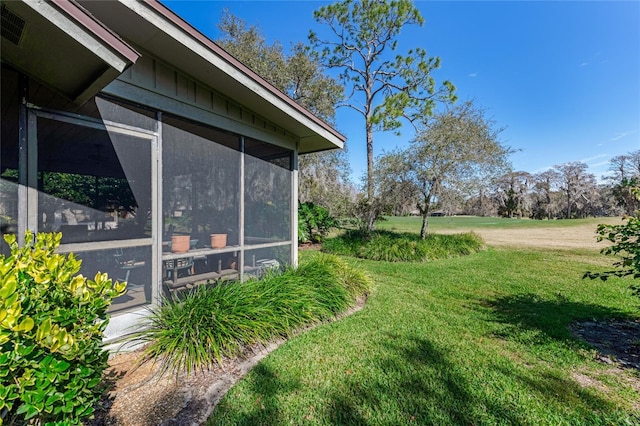 view of yard featuring a sunroom