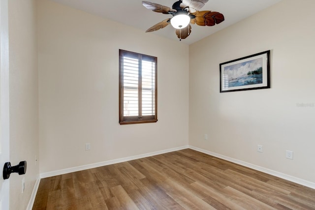 spare room featuring ceiling fan and light wood-type flooring