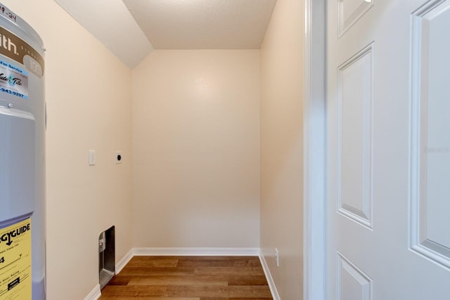 laundry area featuring hardwood / wood-style floors and electric dryer hookup