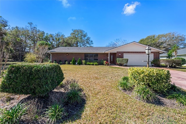 single story home featuring a garage and a front yard