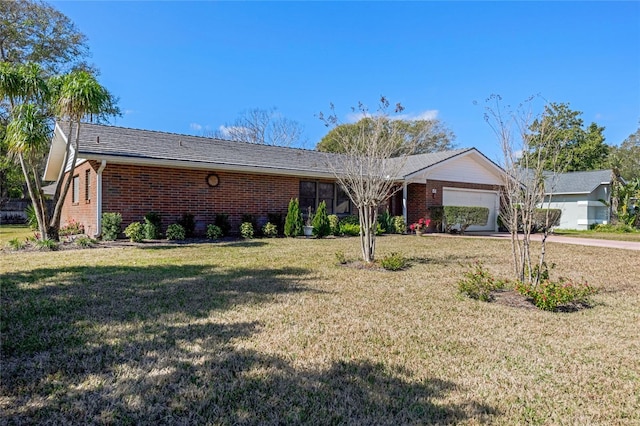 ranch-style house featuring a garage and a front yard