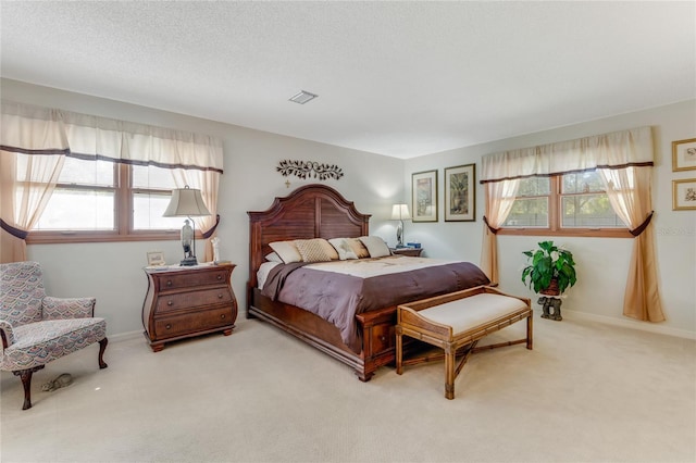 carpeted bedroom with a textured ceiling