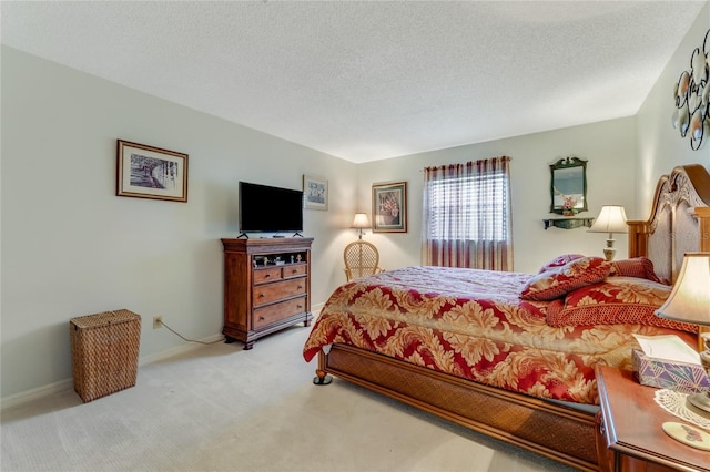 carpeted bedroom featuring a textured ceiling