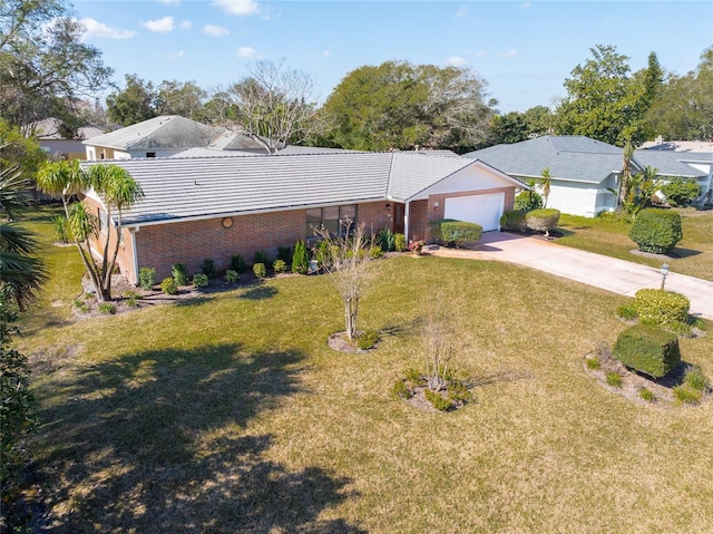 single story home featuring a garage and a front yard