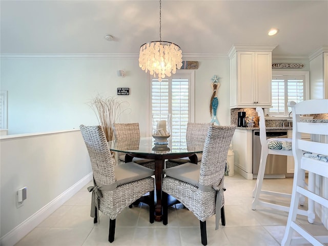 tiled dining space featuring crown molding and a chandelier