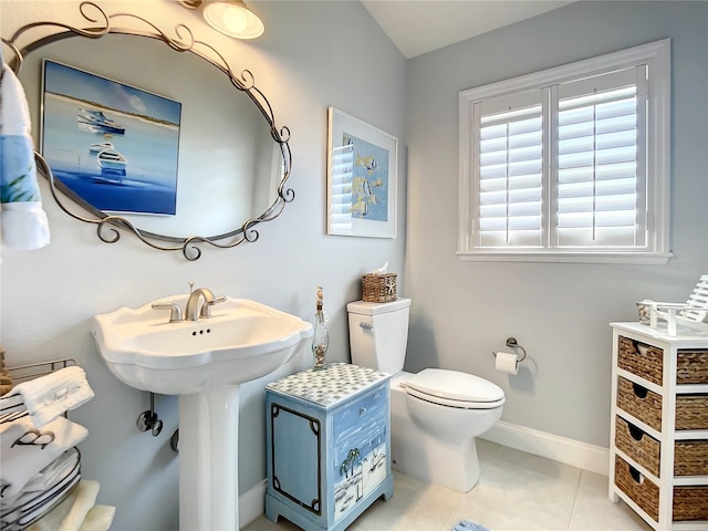 bathroom featuring sink, tile patterned floors, and toilet