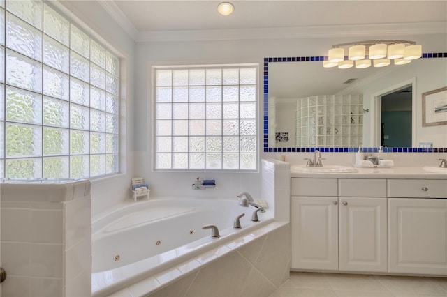 bathroom featuring tile patterned floors, ornamental molding, vanity, and tiled tub