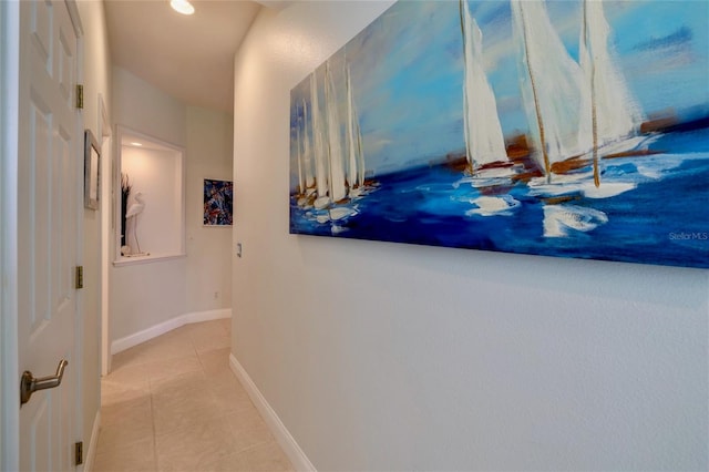 hallway featuring light tile patterned floors