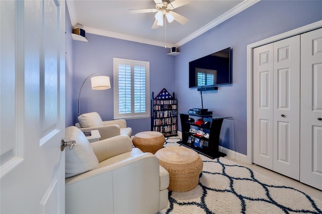 living room featuring ceiling fan, ornamental molding, and light tile patterned floors