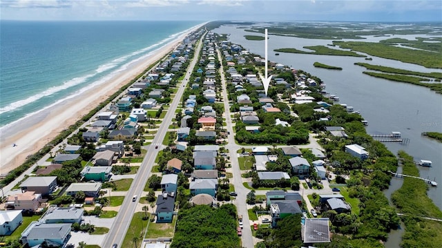 bird's eye view featuring a beach view and a water view