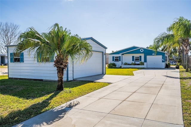 view of front of house featuring a garage and a front yard