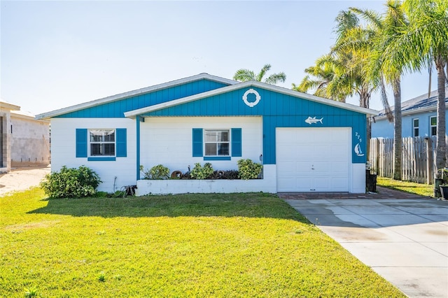 ranch-style home with a garage and a front yard