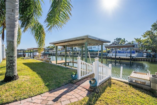 dock area featuring a yard and a water view