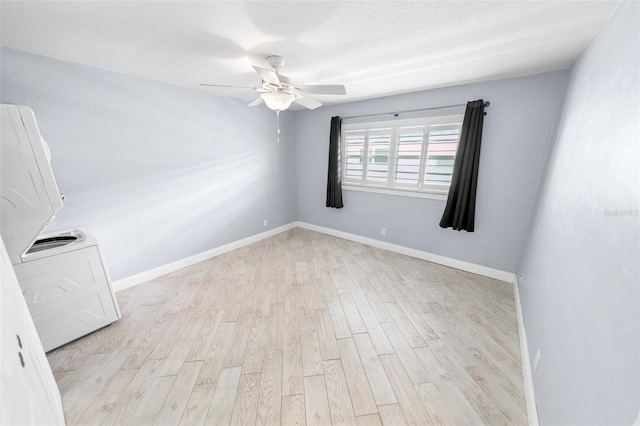 unfurnished room featuring washer / clothes dryer, ceiling fan, a textured ceiling, and light hardwood / wood-style floors