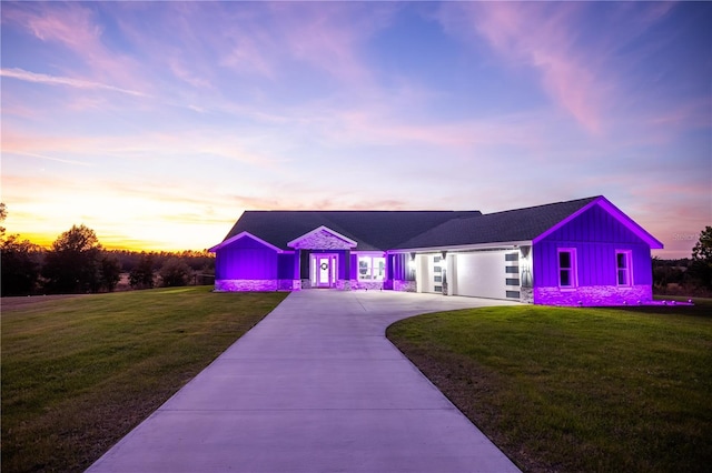 view of front of home with a lawn