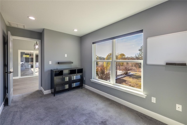 view of carpeted spare room