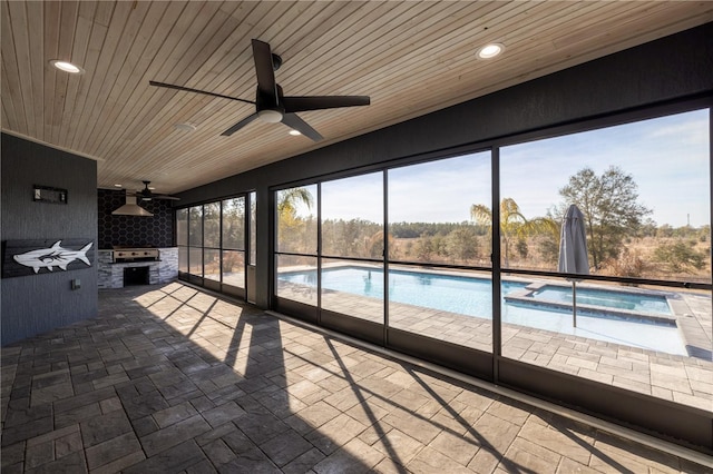 unfurnished sunroom with wood ceiling