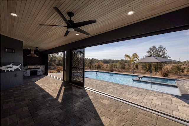 view of swimming pool featuring grilling area and ceiling fan