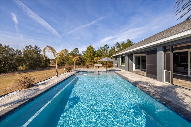 view of pool featuring an in ground hot tub and a patio